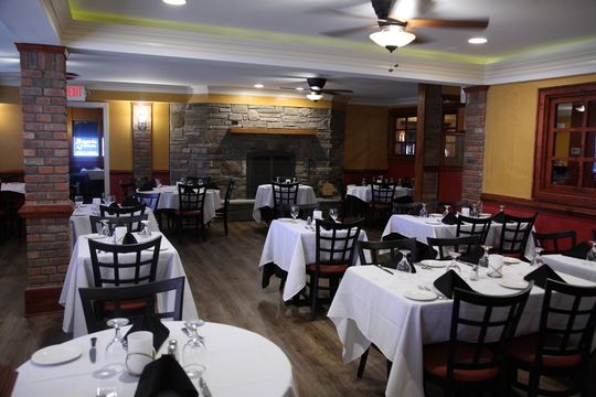 Dining room with stone fireplace