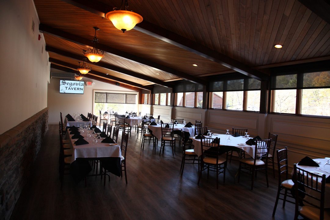 Elegant dining room set for a private event at Segovia Tavern
