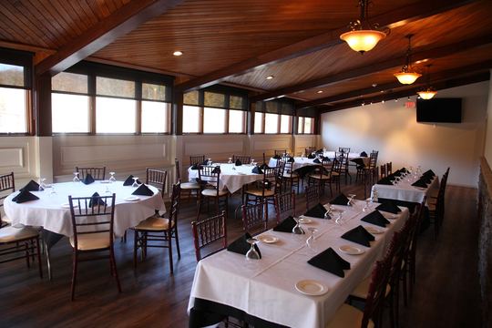 Upstairs event room with wood ceiling